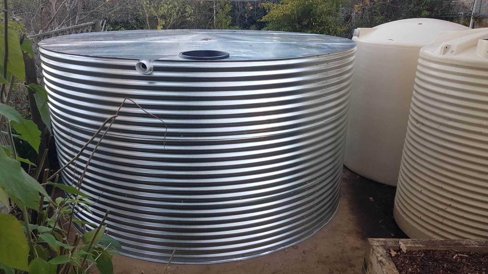 Glavanised Steel Rainwater Tank next to Poly tanks at Carey Gully SA