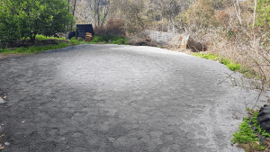 grey road base used to prepare area for rainwater tank 