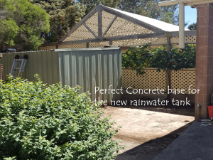 base for rainwater tank behind shadehouse and next to green shed