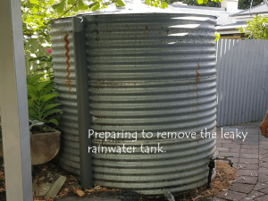 preparing to move the leaky rainwater tank
